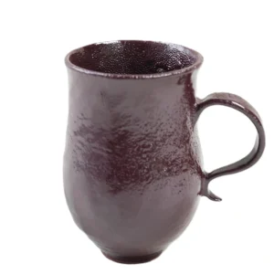 Straight front shot of rustic burgundy handmade Hufeng clay mug, display smooth curved handle and full natural floating red glaze surface